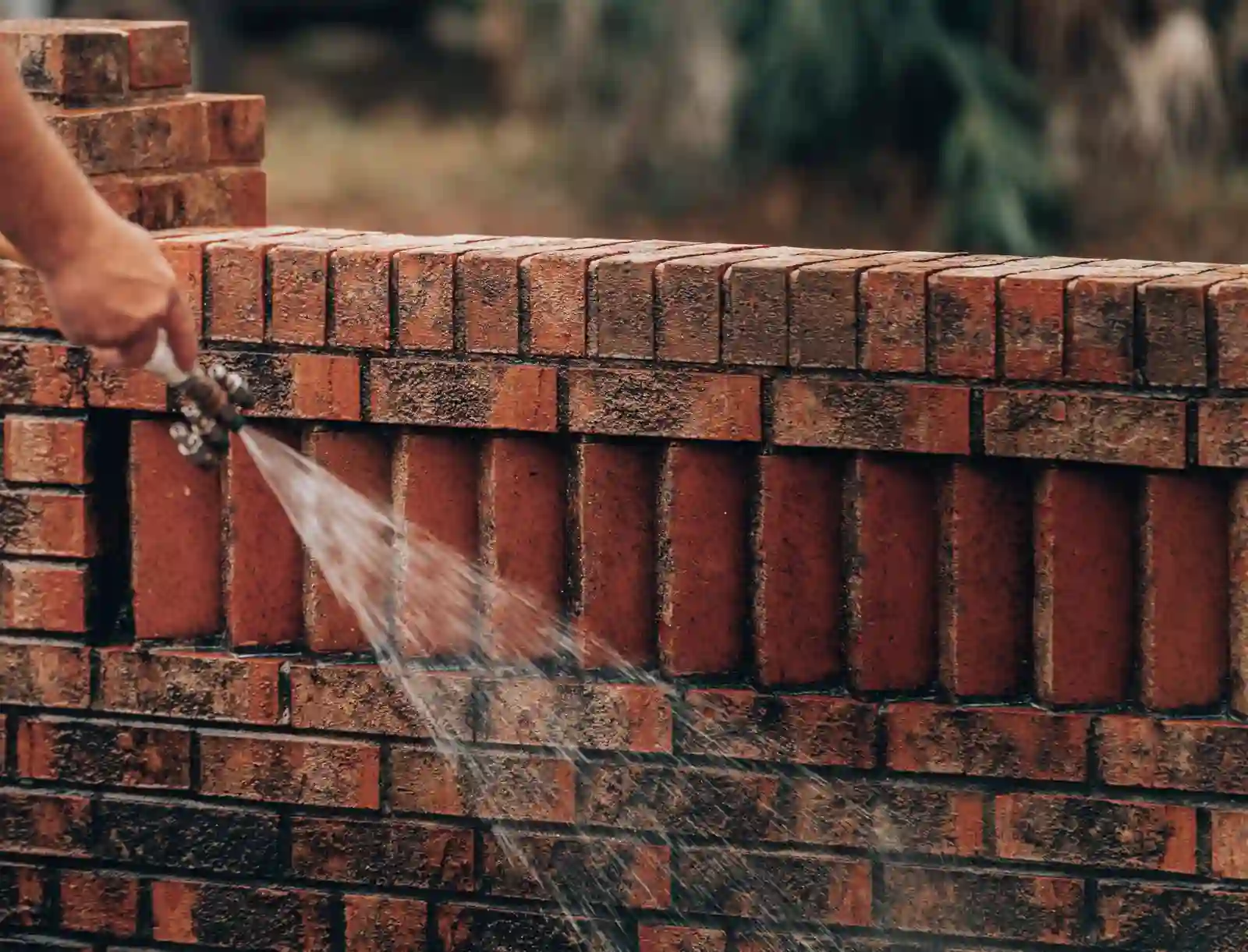 Soft washing brick wall